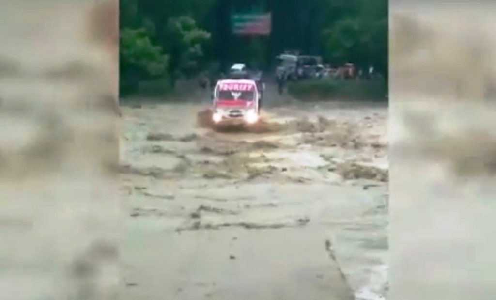 bus gets swept away in brimming stream