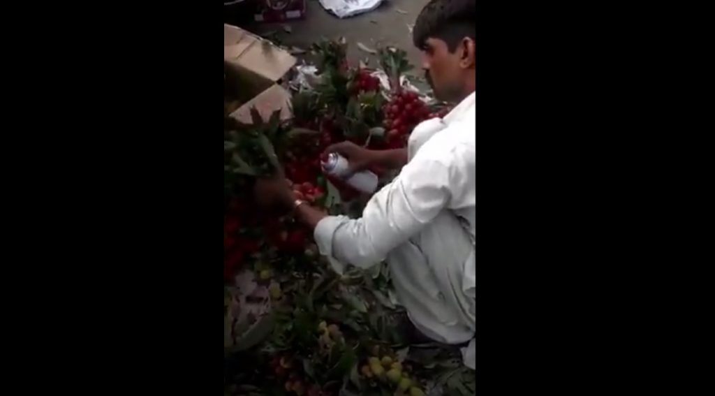 fruit sellers using chemical spray