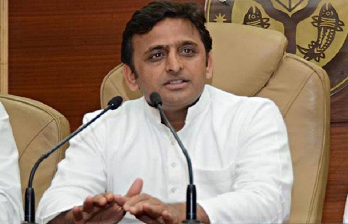 akhilesh yadav warns up police