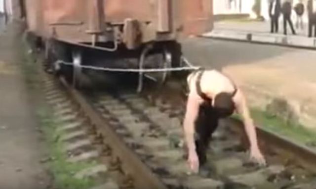 man pulling train