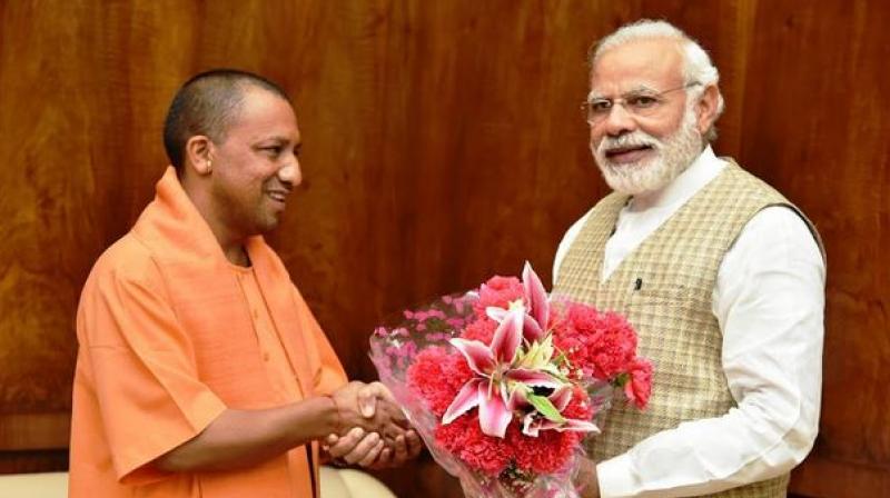 yogi meets pm modi