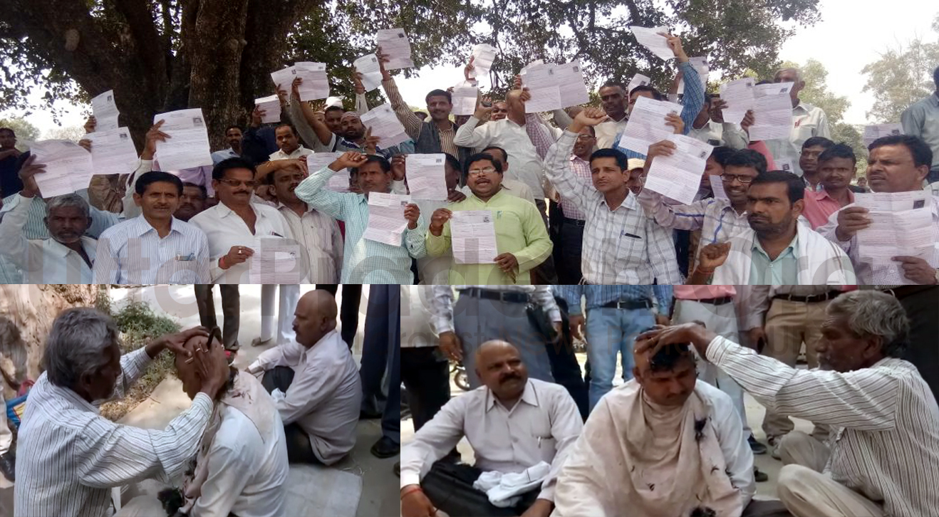 vitt vihin shikshak Shaving head protested against UP Board copy check