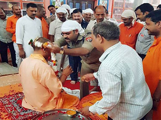 UP cop in uniform kneels down before CM Yogi Adityanath