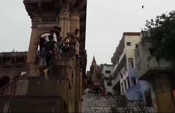 boys jumping into the river