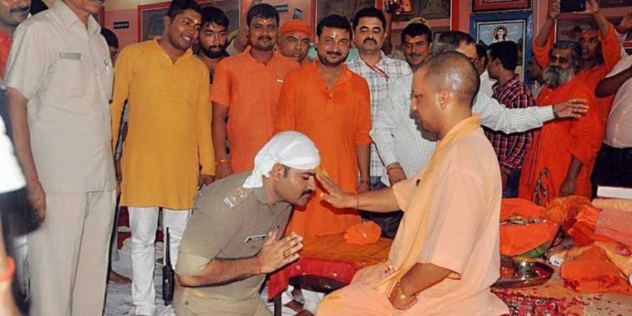 UP cop in uniform kneels down before CM Yogi