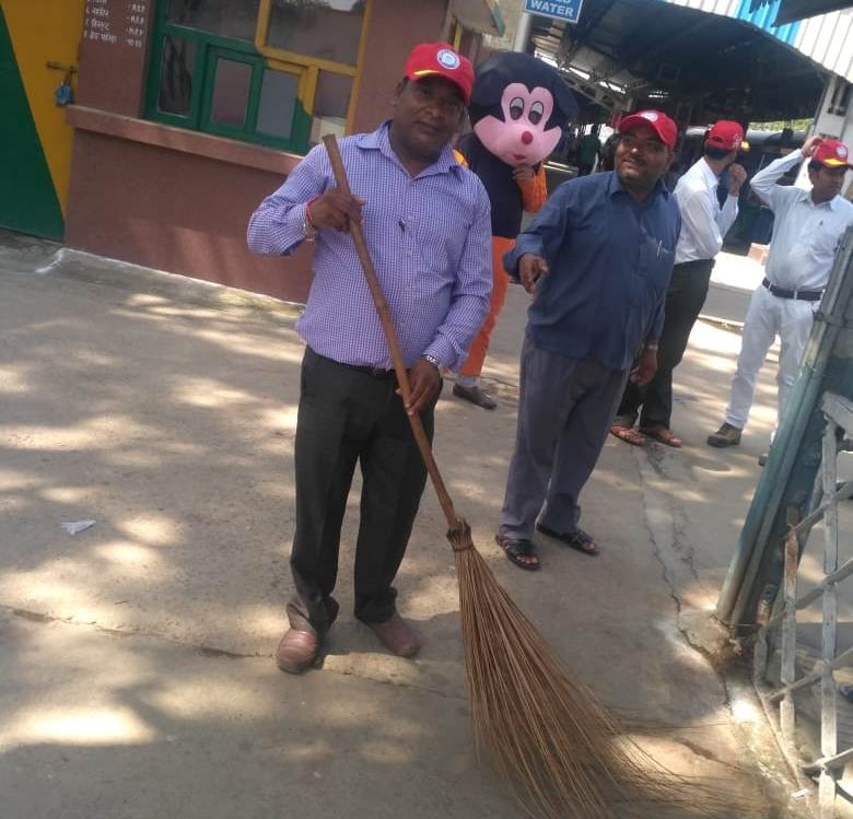 Chief Conservancy inspector cleaning railway station