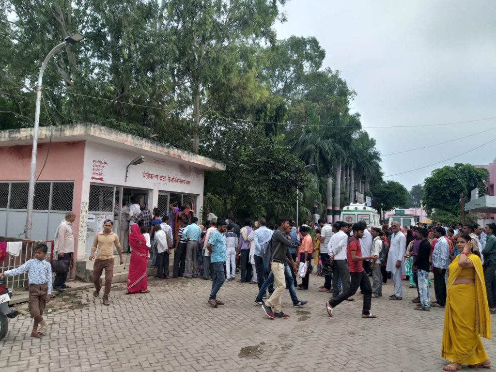 patients waiting in Long line for prescription in district hospital