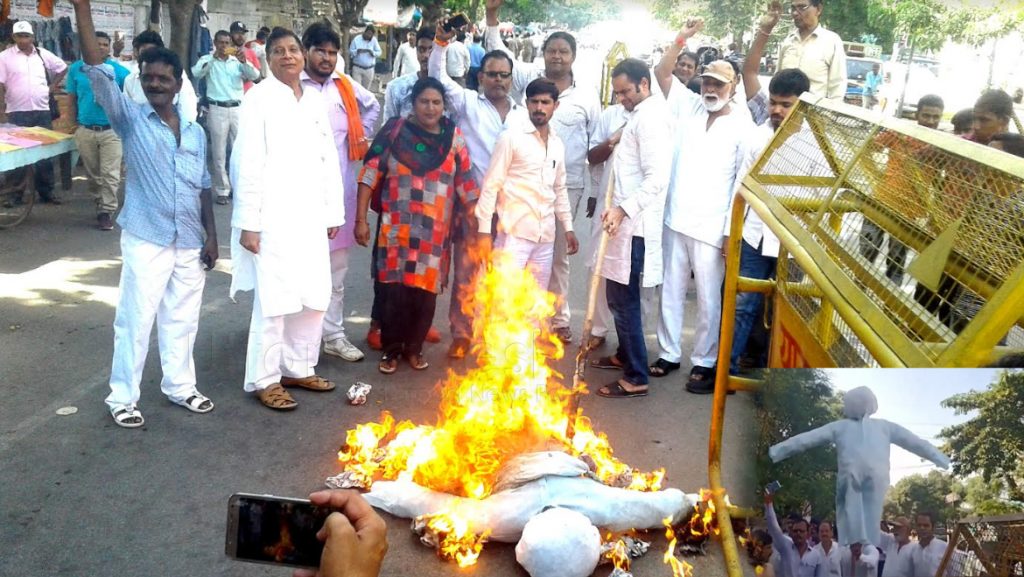 Lucknow: RLD Burnt Effigy of Central Govt outside BJP office