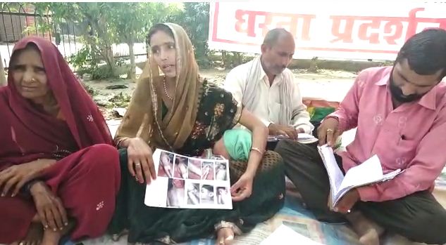 mother protesting with her family for justice