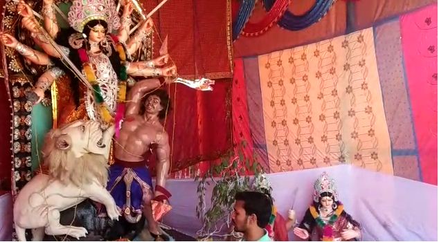 muslim man hold durga puja shows communal harmony